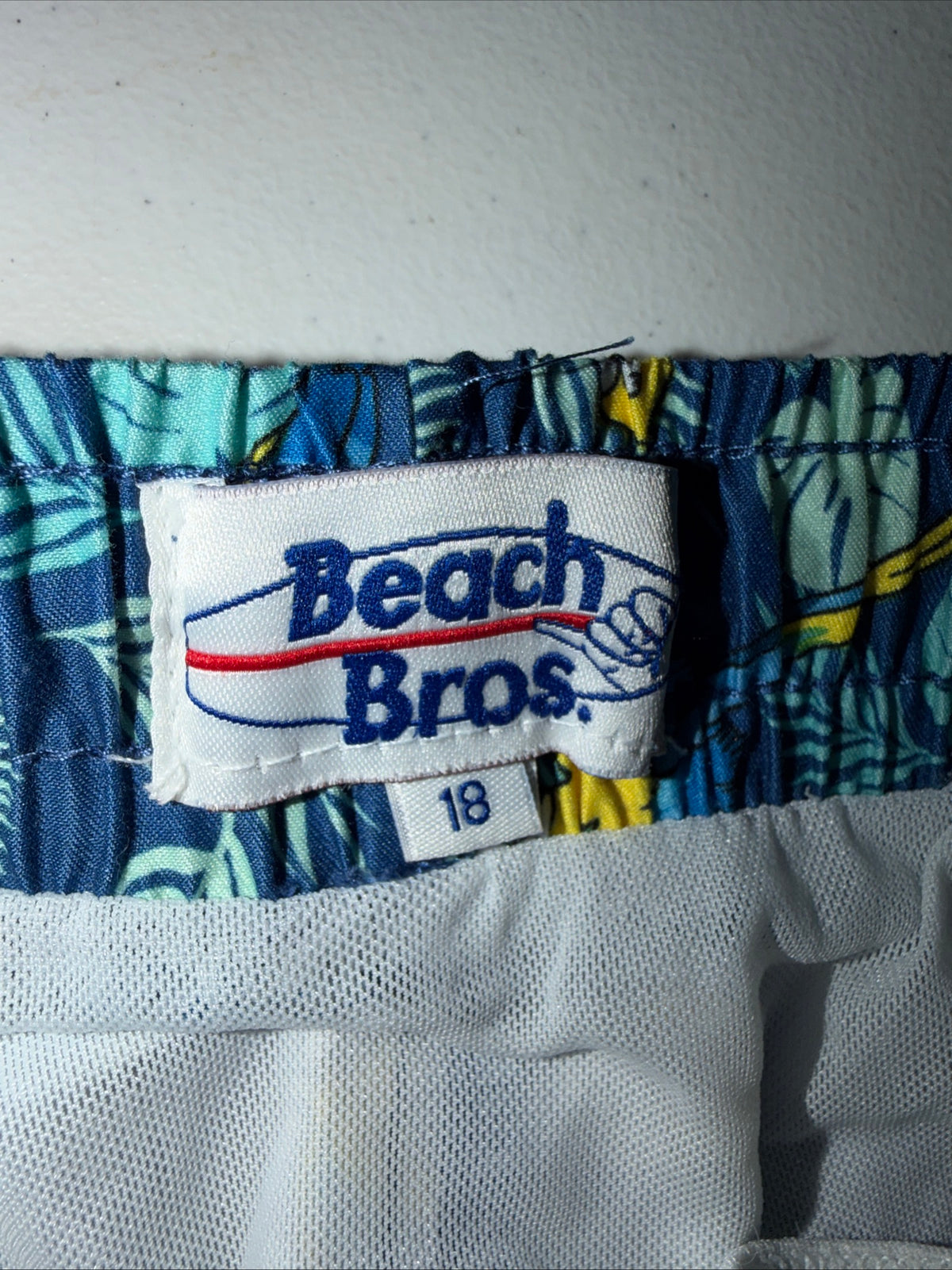 Beach Boys Surf Shop Short Swim trunks with A blue parrot pattern size 18 Boys