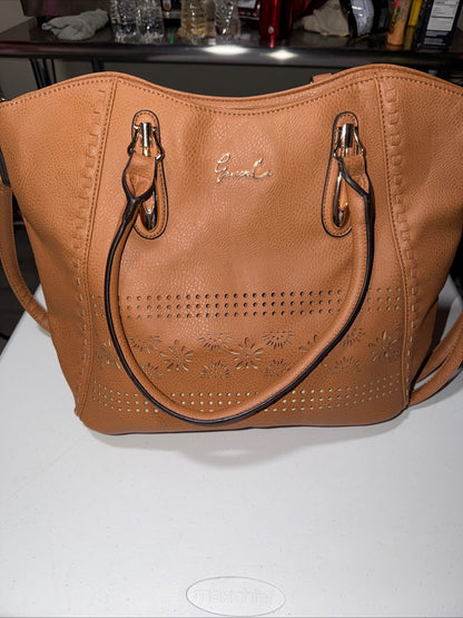 LerssaCi Tan Handbag With perforated floral cutouts and gold-toned hardware.