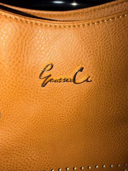 LerssaCi Tan Handbag With perforated floral cutouts and gold-toned hardware.